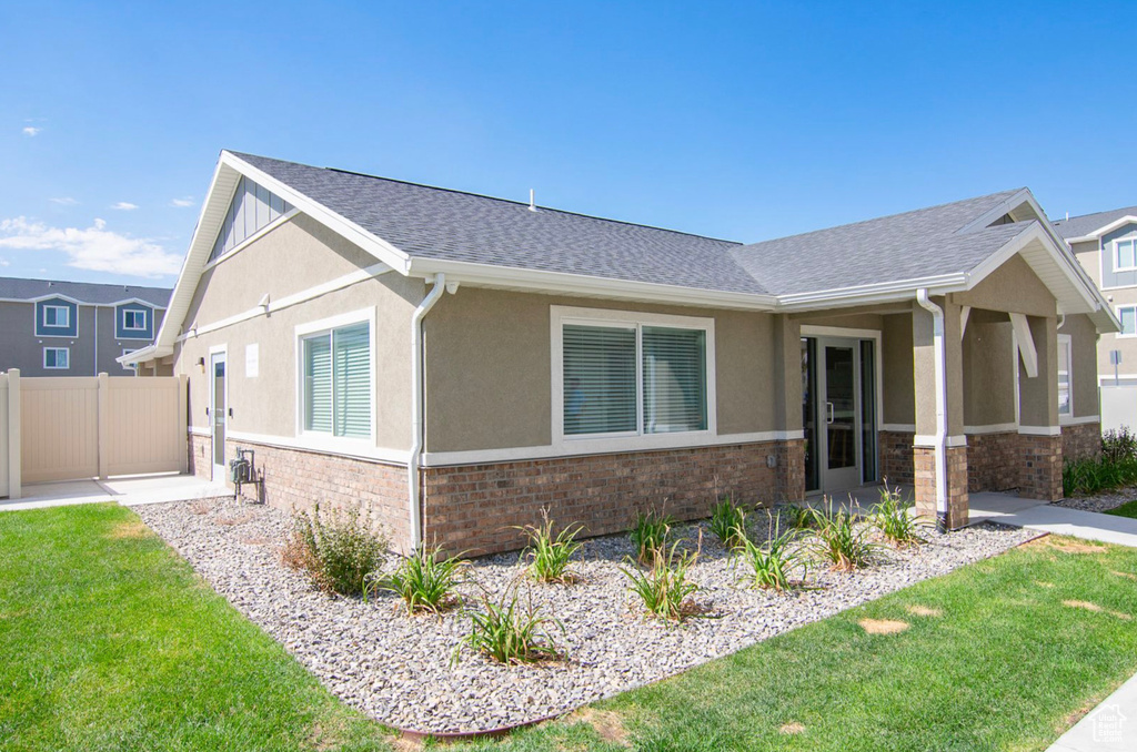 View of front of property with a front yard