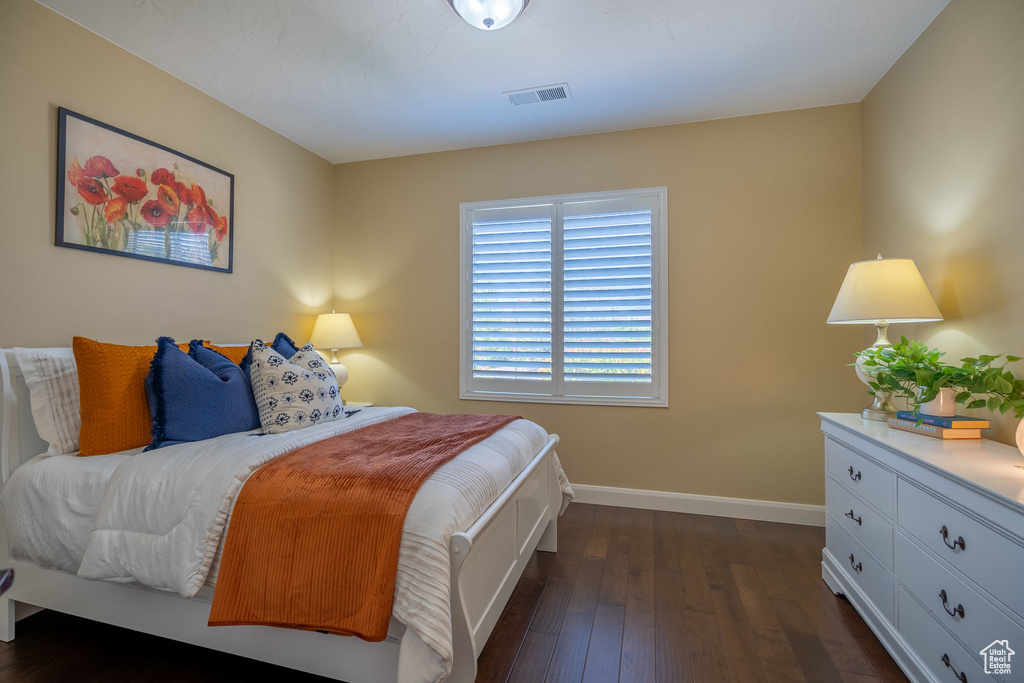 Bedroom featuring dark hardwood / wood-style flooring