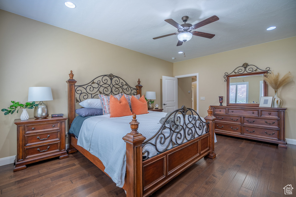 Bedroom featuring ceiling fan and dark hardwood / wood-style flooring