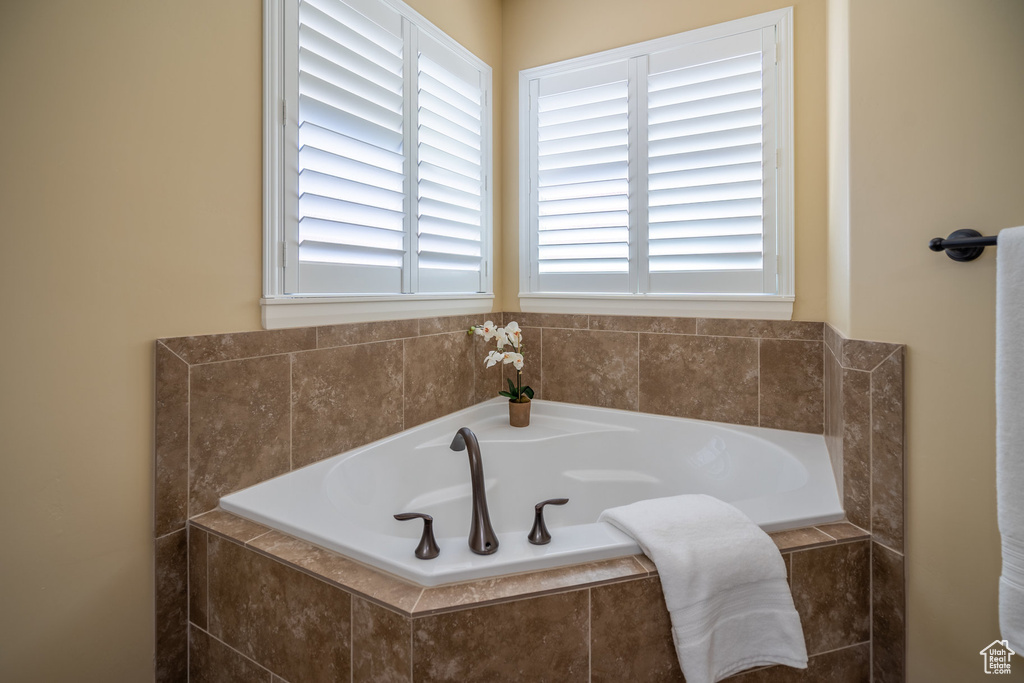 Bathroom with a relaxing tiled bath