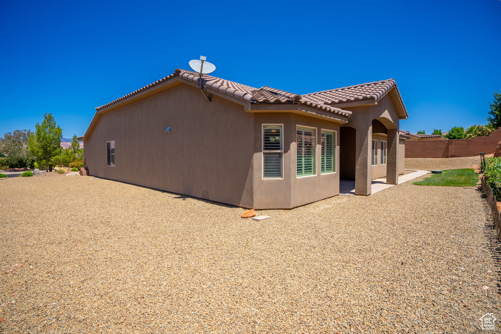 Rear view of house featuring a patio area