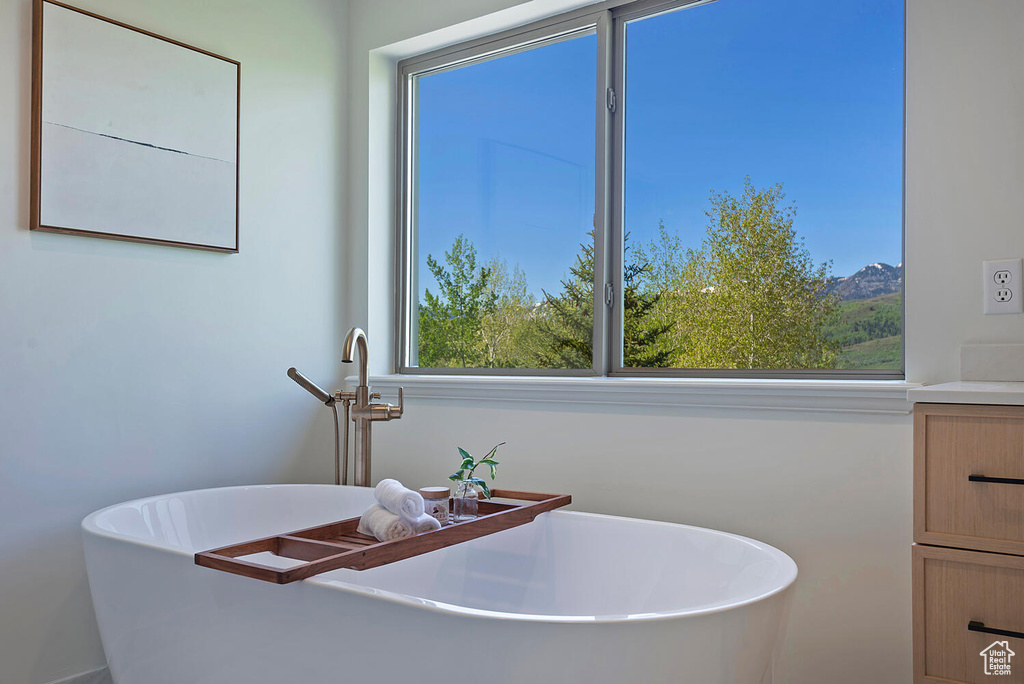 Bathroom with plenty of natural light and vanity