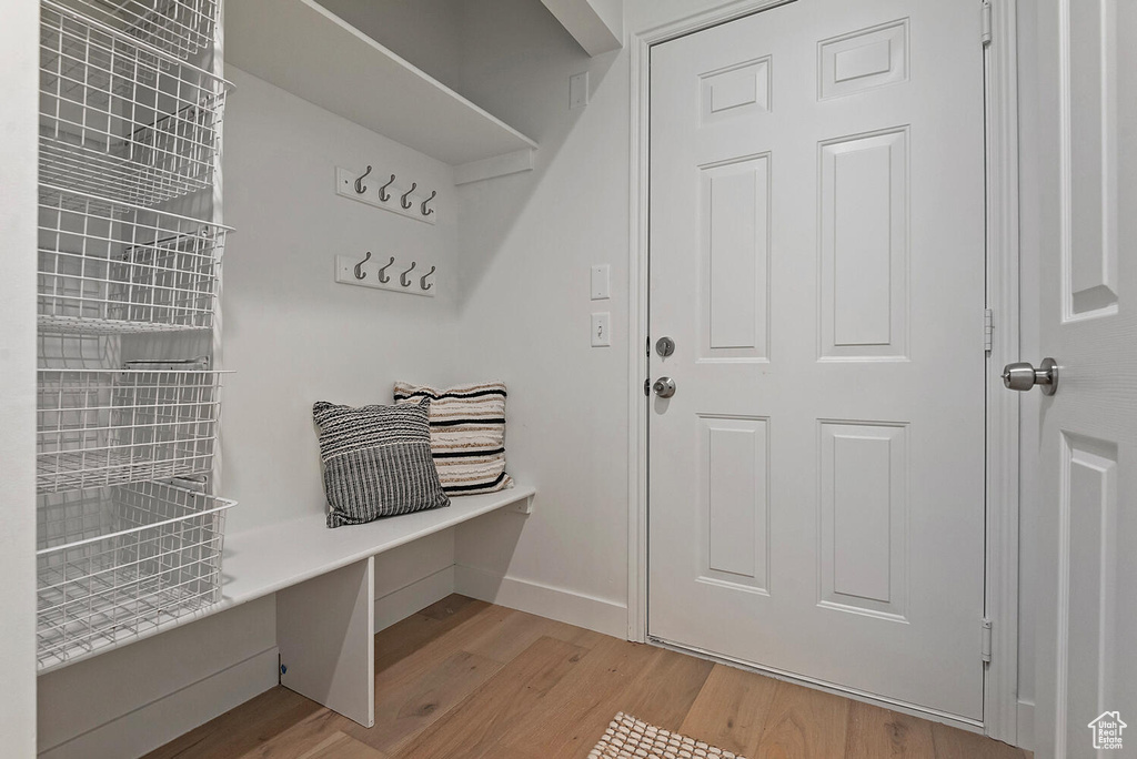 Mudroom with hardwood / wood-style flooring