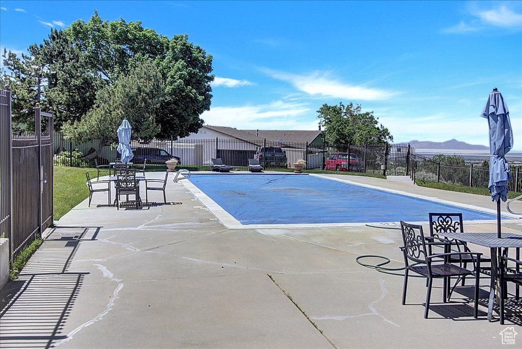 View of swimming pool with a patio area