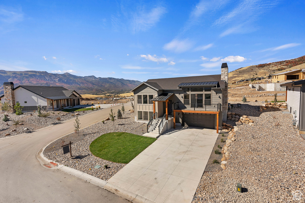 View of front of house with a mountain view