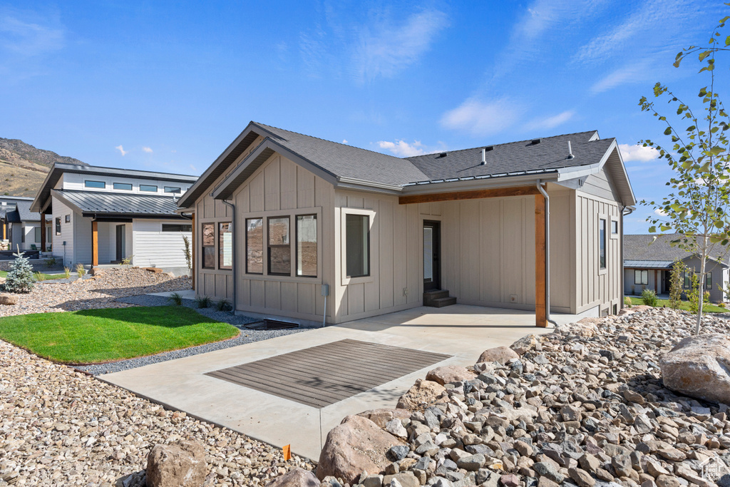 Rear view of property with a patio