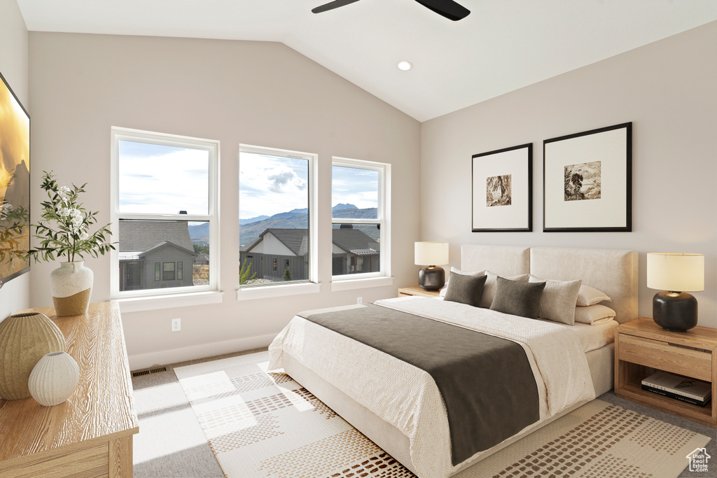 Bedroom featuring lofted ceiling and ceiling fan