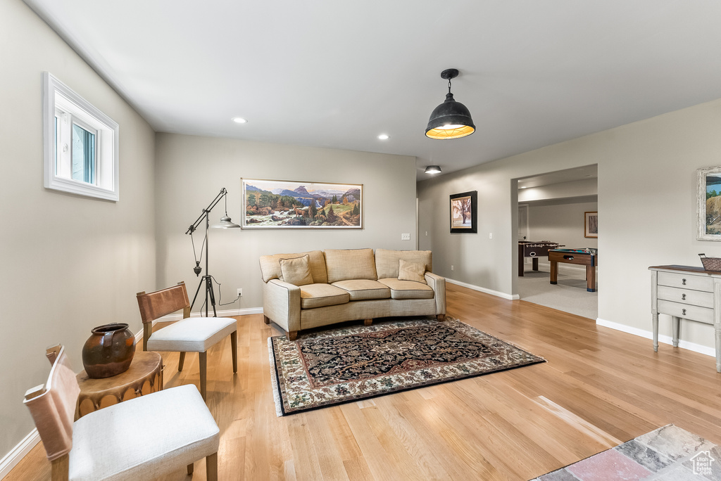 Living room with light hardwood / wood-style flooring