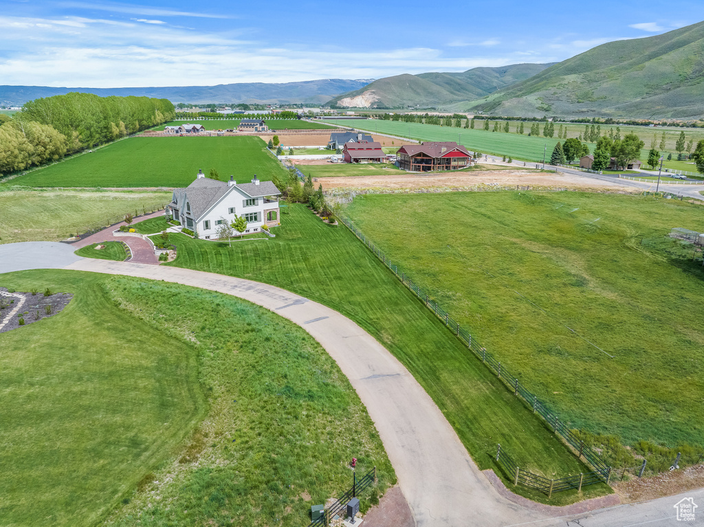 Birds eye view of property with a mountain view and a rural view