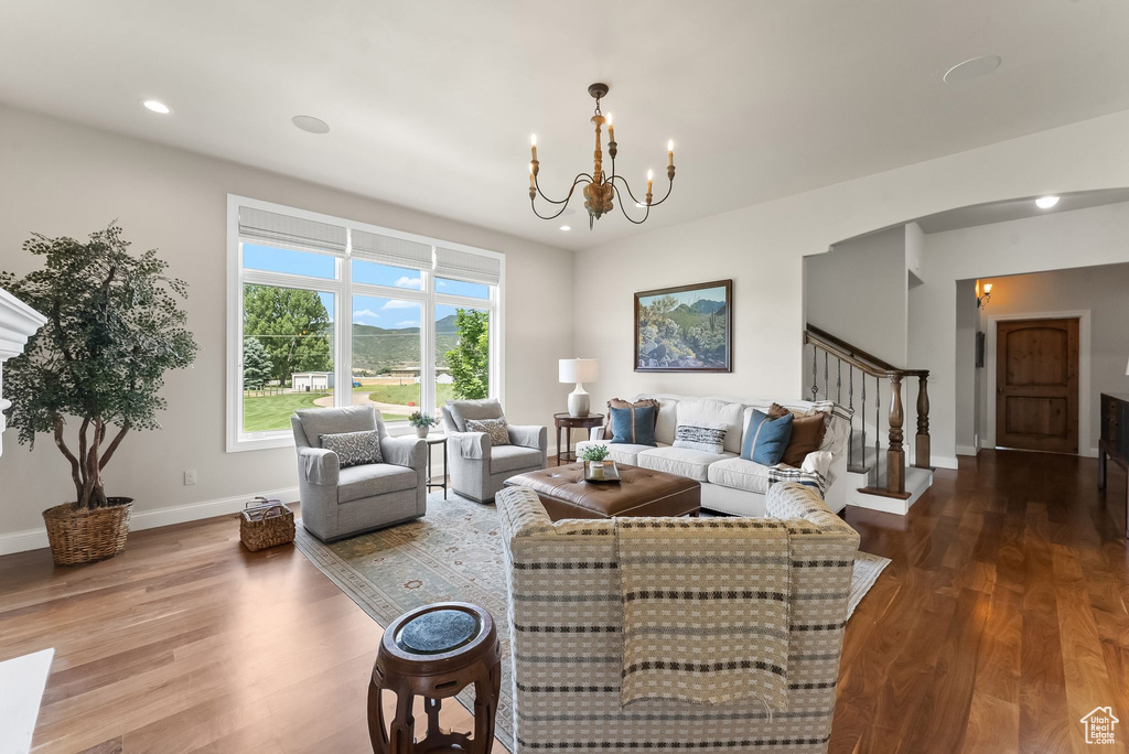 Living room featuring hardwood / wood-style floors and a chandelier