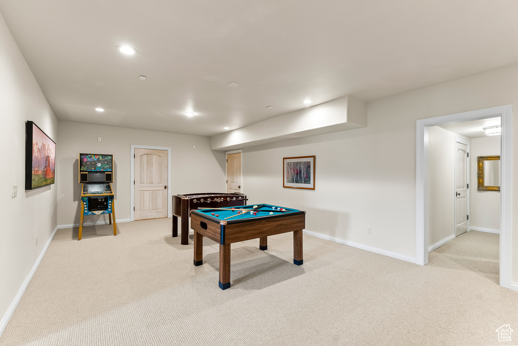 Playroom with light colored carpet and billiards