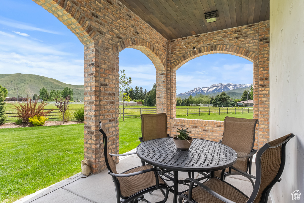 View of patio / terrace with a mountain view