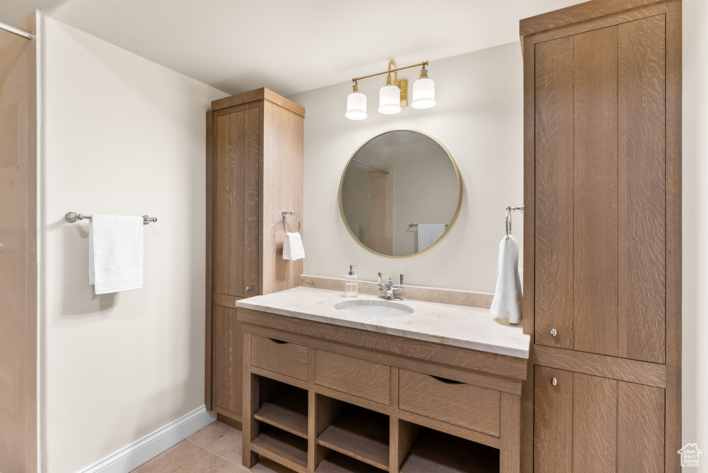 Bathroom with tile flooring and oversized vanity