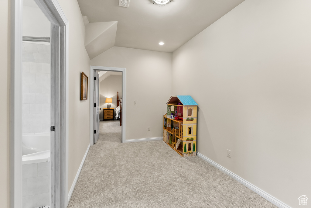 Rec room with light colored carpet