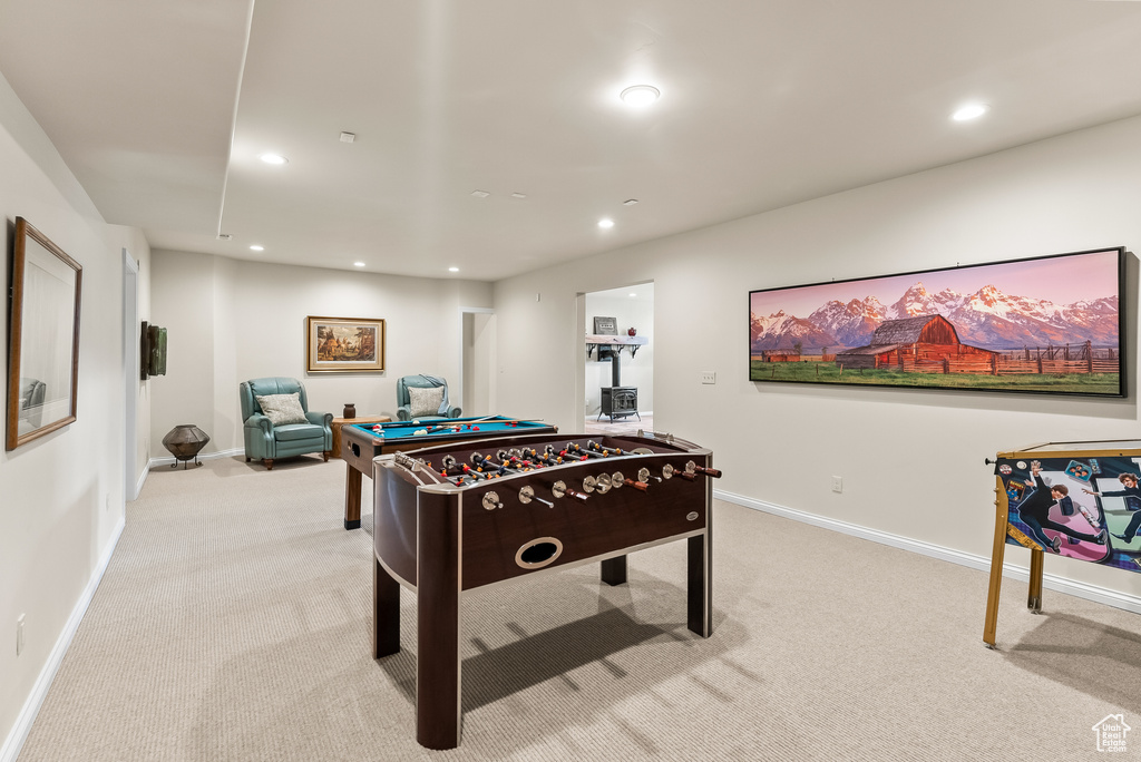 Game room featuring light carpet