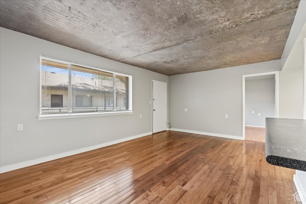 Empty room featuring hardwood / wood-style flooring