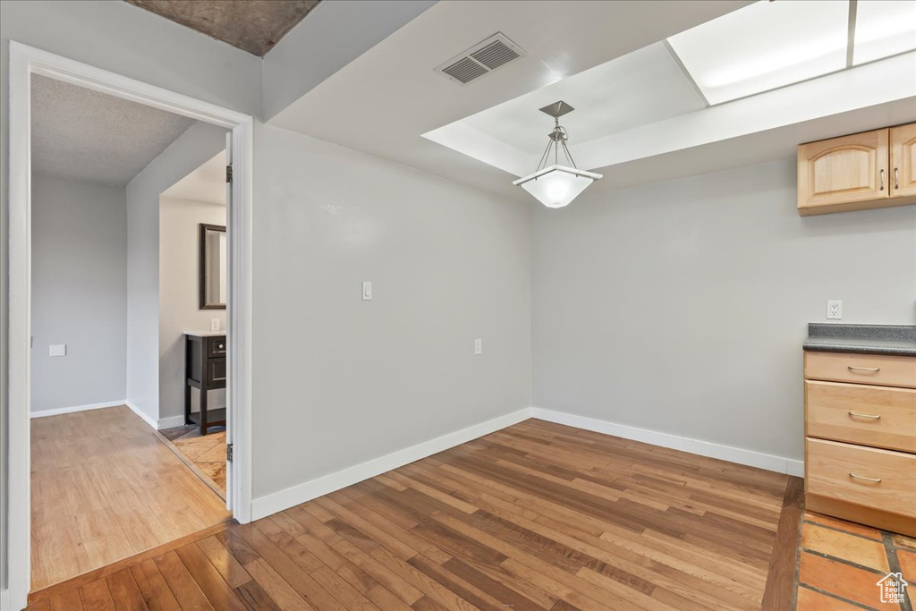 Spare room with light hardwood / wood-style floors