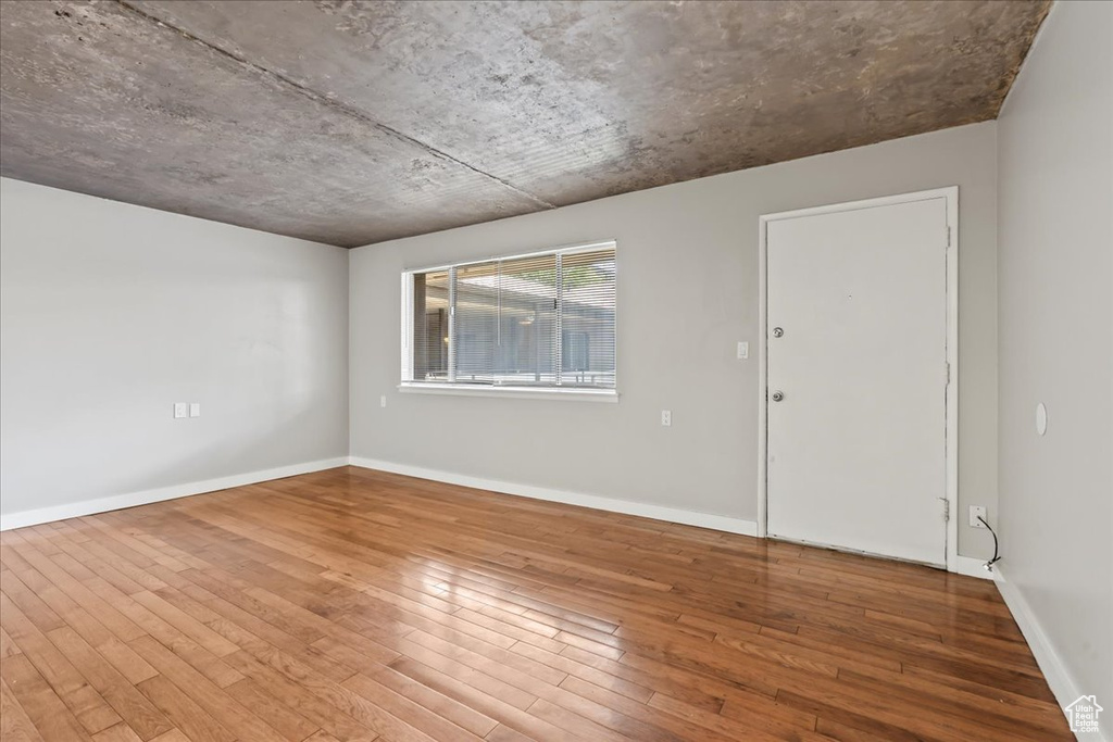 Unfurnished room featuring hardwood / wood-style floors