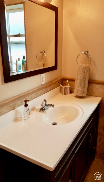 Bathroom with tile floors and large vanity