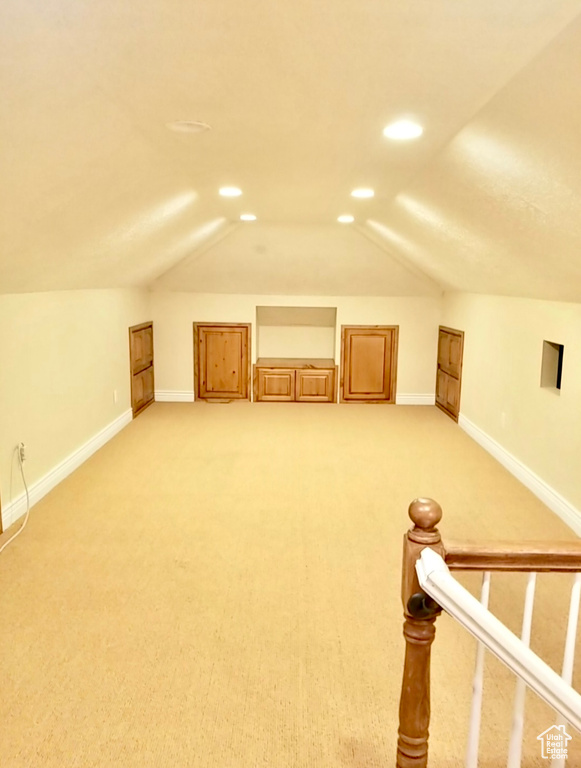 Bonus room featuring carpet floors and lofted ceiling