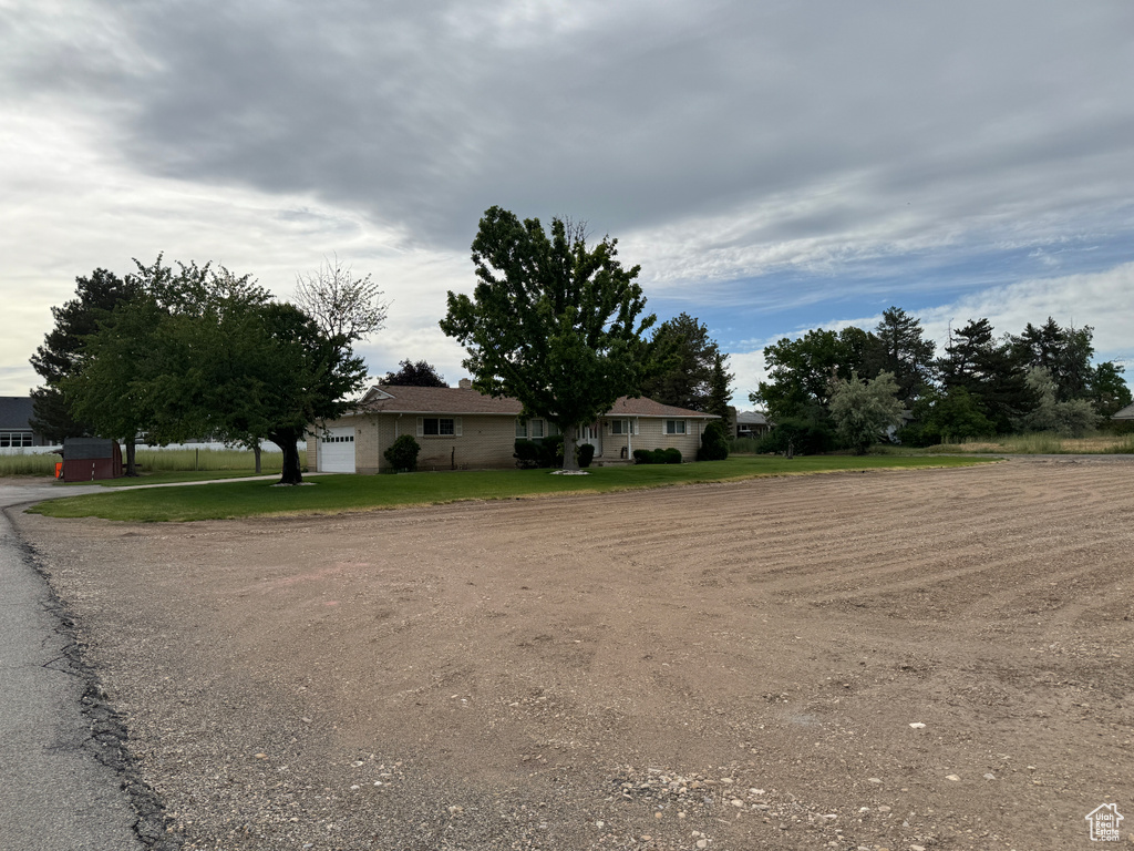 Ranch-style home with a front yard