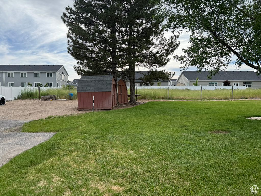 View of yard featuring a storage shed