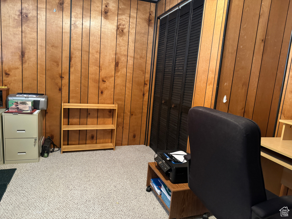 Office with carpet and wooden walls