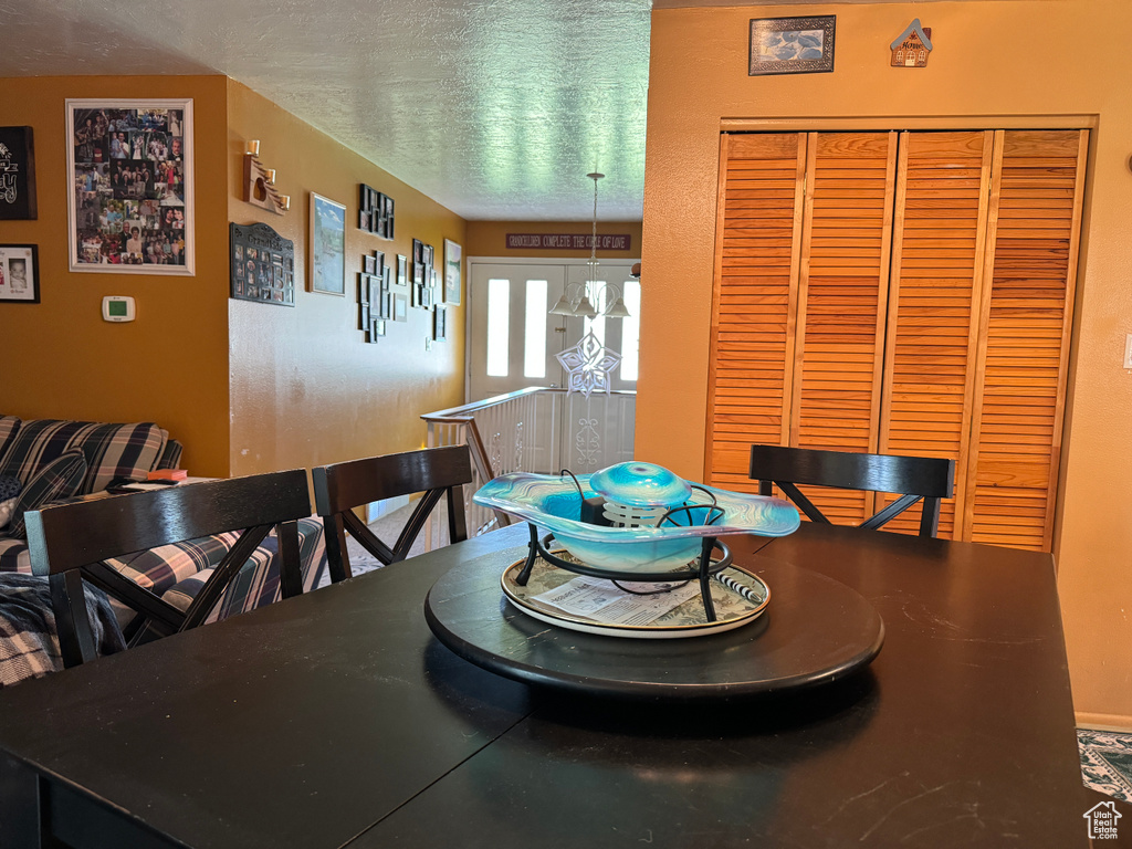 Dining space with a textured ceiling