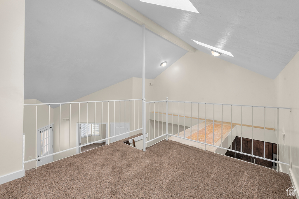 Bonus room with carpet and lofted ceiling with skylight