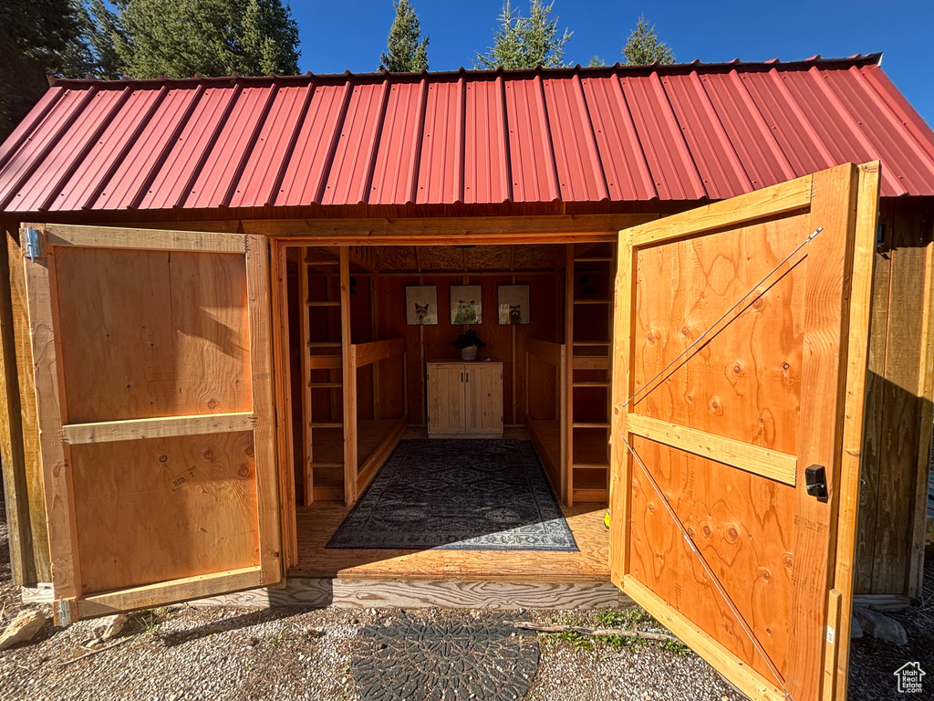 View of stable featuring an outdoor structure