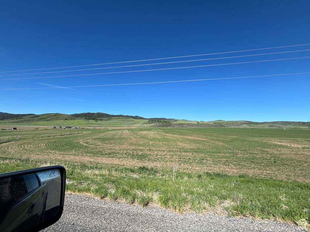 View of yard with a rural view