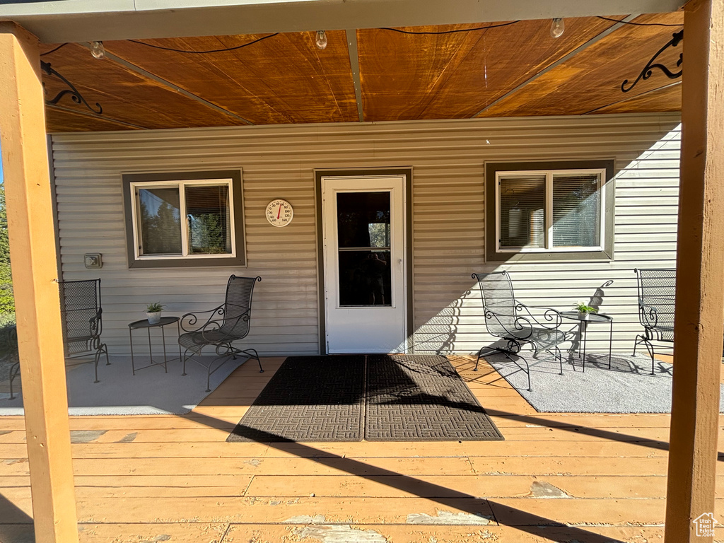 Property entrance with a wooden deck