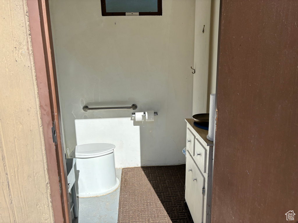 Bathroom featuring toilet and vanity