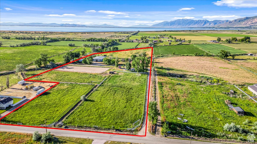 Birds eye view of property featuring a mountain view and a rural view