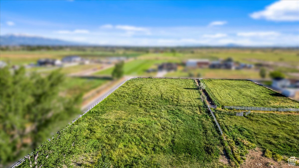 Birds eye view of property featuring a rural view