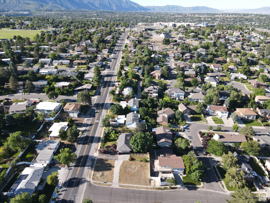 Birds eye view of property with a mountain view