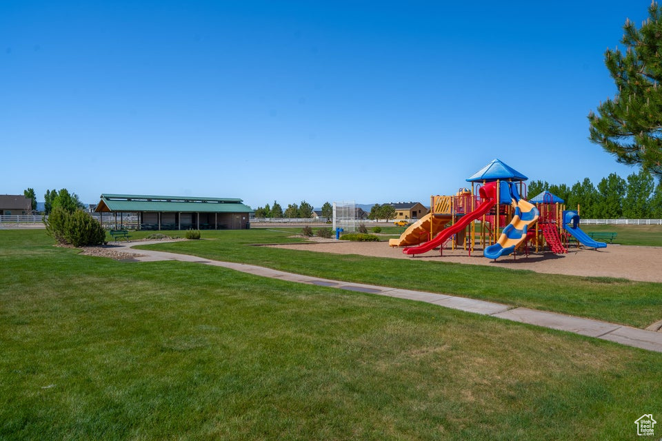 View of play area featuring a yard