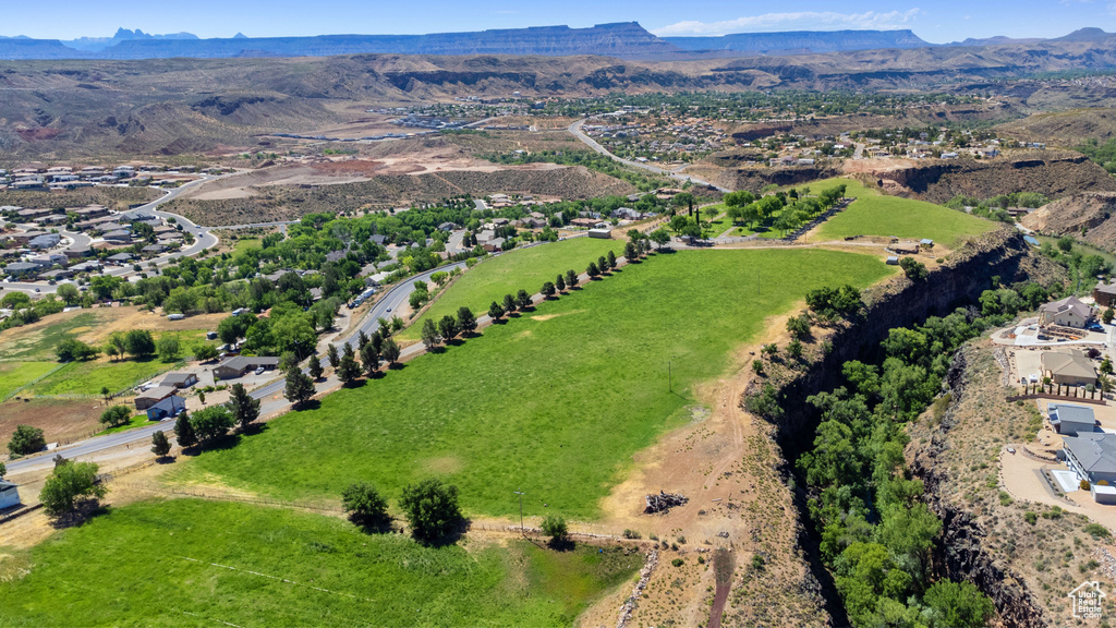 Birds eye view of property with a mountain view