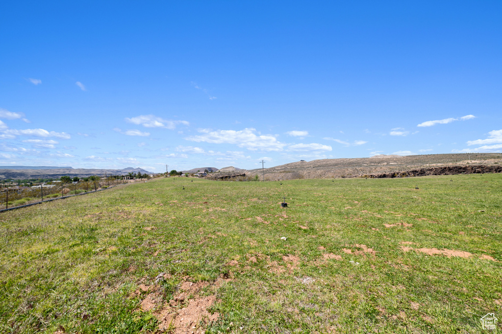 View of yard with a rural view