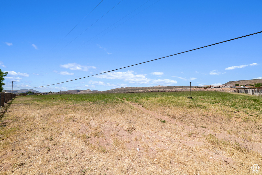 View of yard featuring a mountain view and a rural view