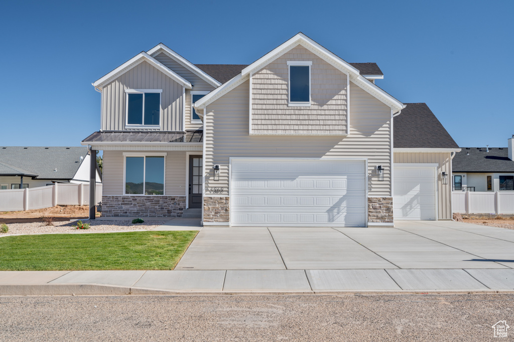 Craftsman-style house featuring a garage