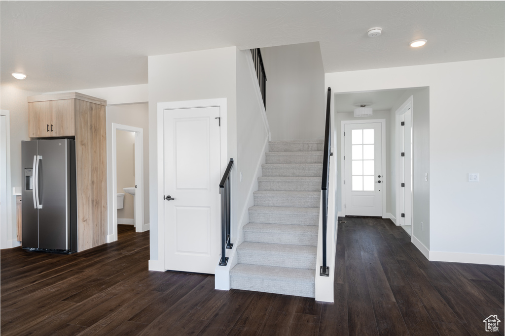 Stairs with hardwood / wood-style flooring