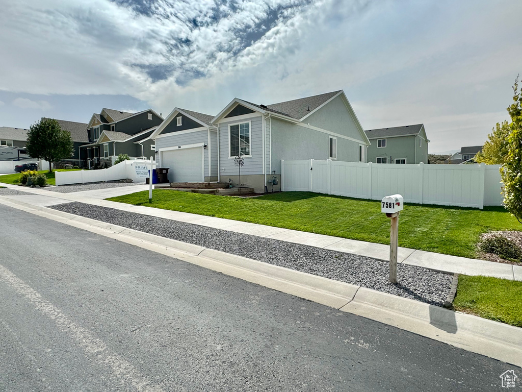 View of front of property with a front lawn