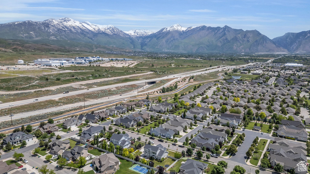 Birds eye view of property with a mountain view