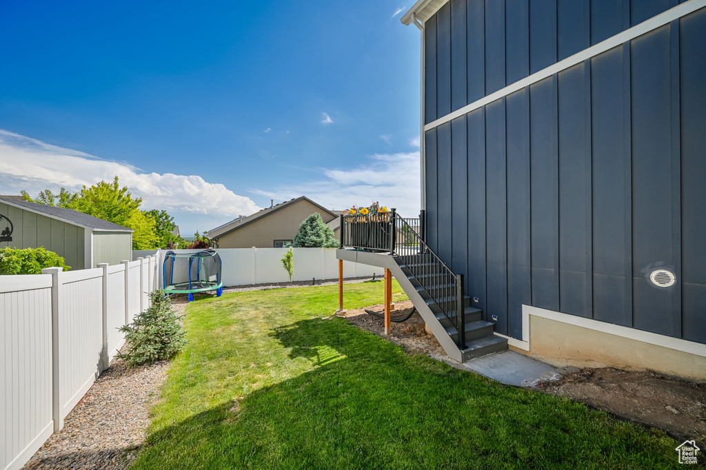 View of yard featuring a trampoline