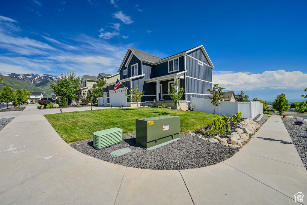 View of side of home with a lawn