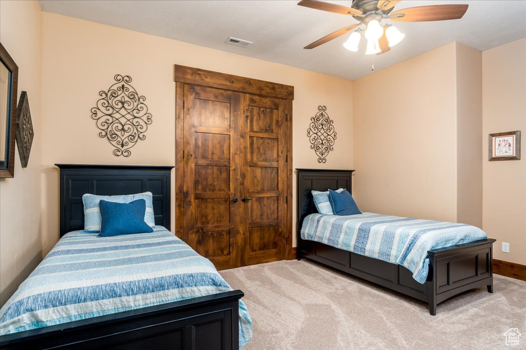 Bedroom with carpet and ceiling fan