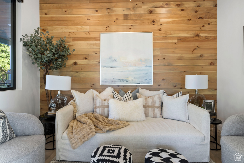 Living room featuring wood walls