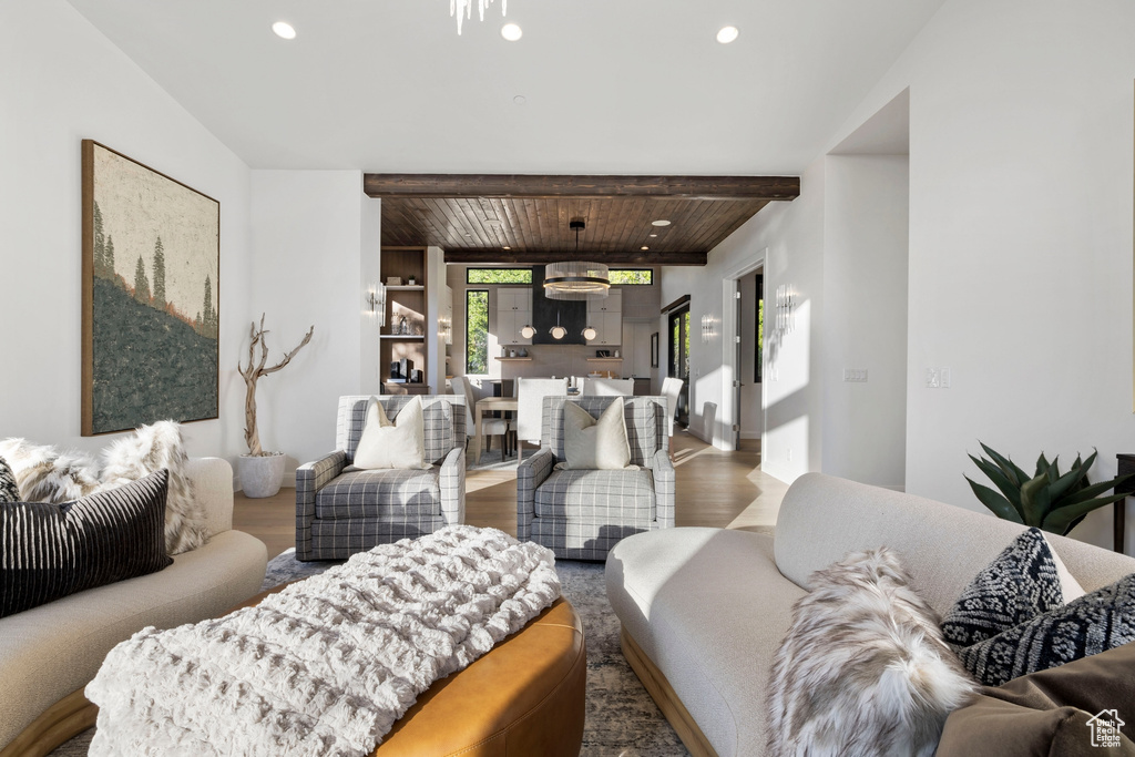 Living room with hardwood / wood-style floors and wood ceiling