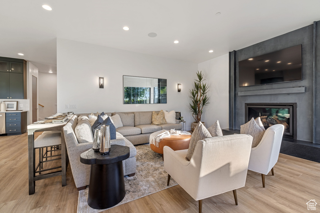 Living room featuring a fireplace and light wood-type flooring